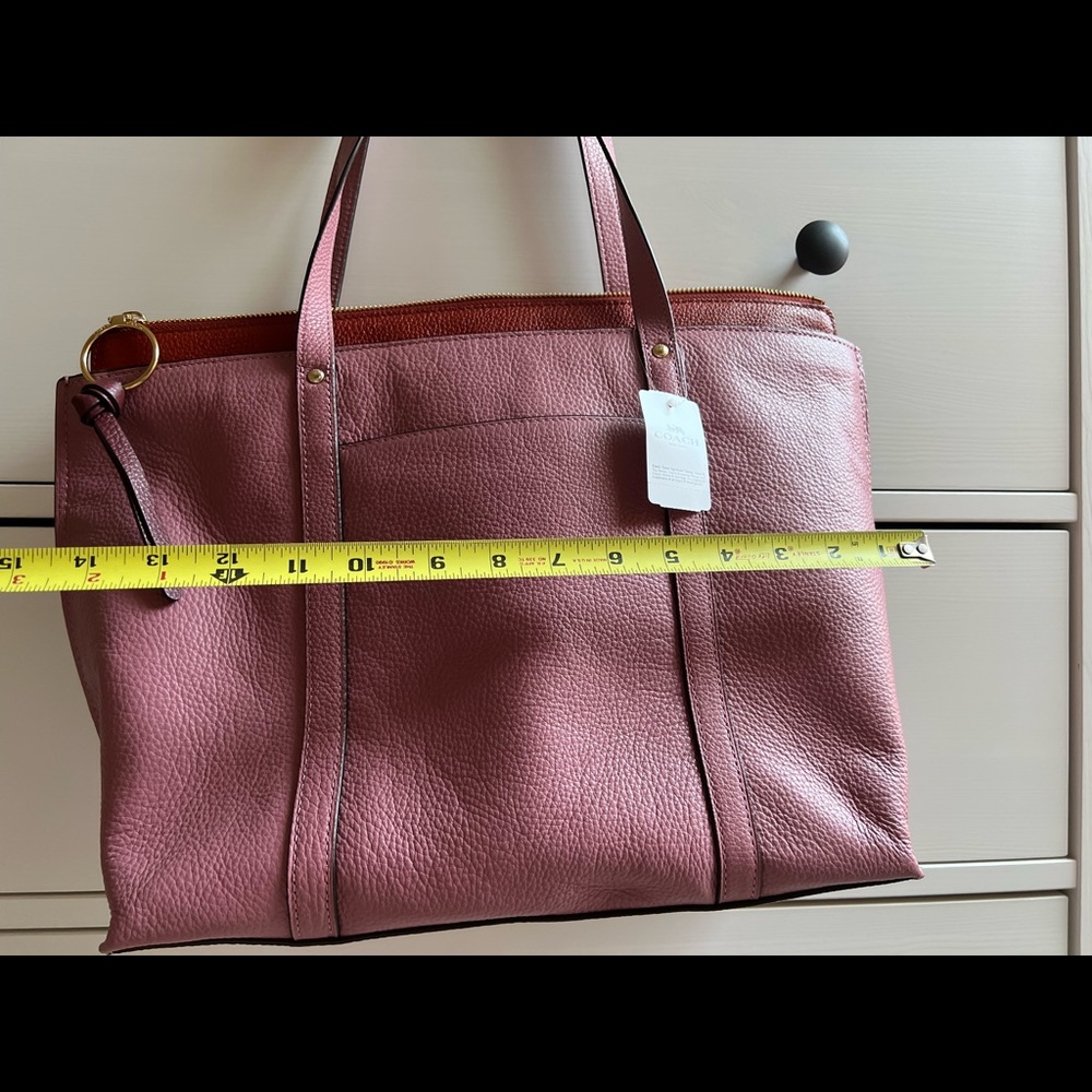 Brand new Coach leather tote bag. Great details. Nice storage and extra pockets.